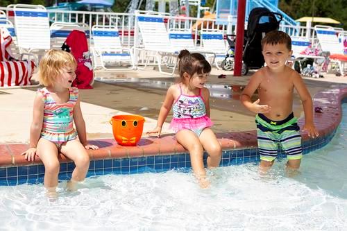 Toddlers playing in kiddie pool at Cove Point Pool