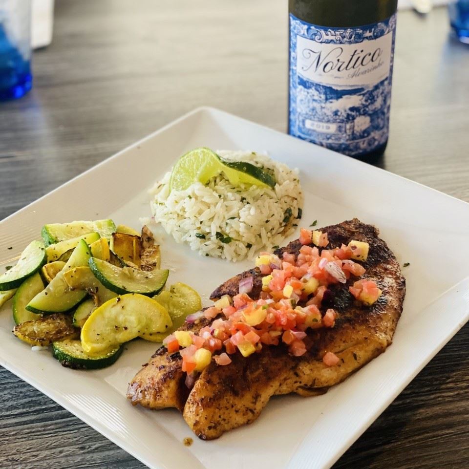 Blackened snapped with zucchini, rice and wine