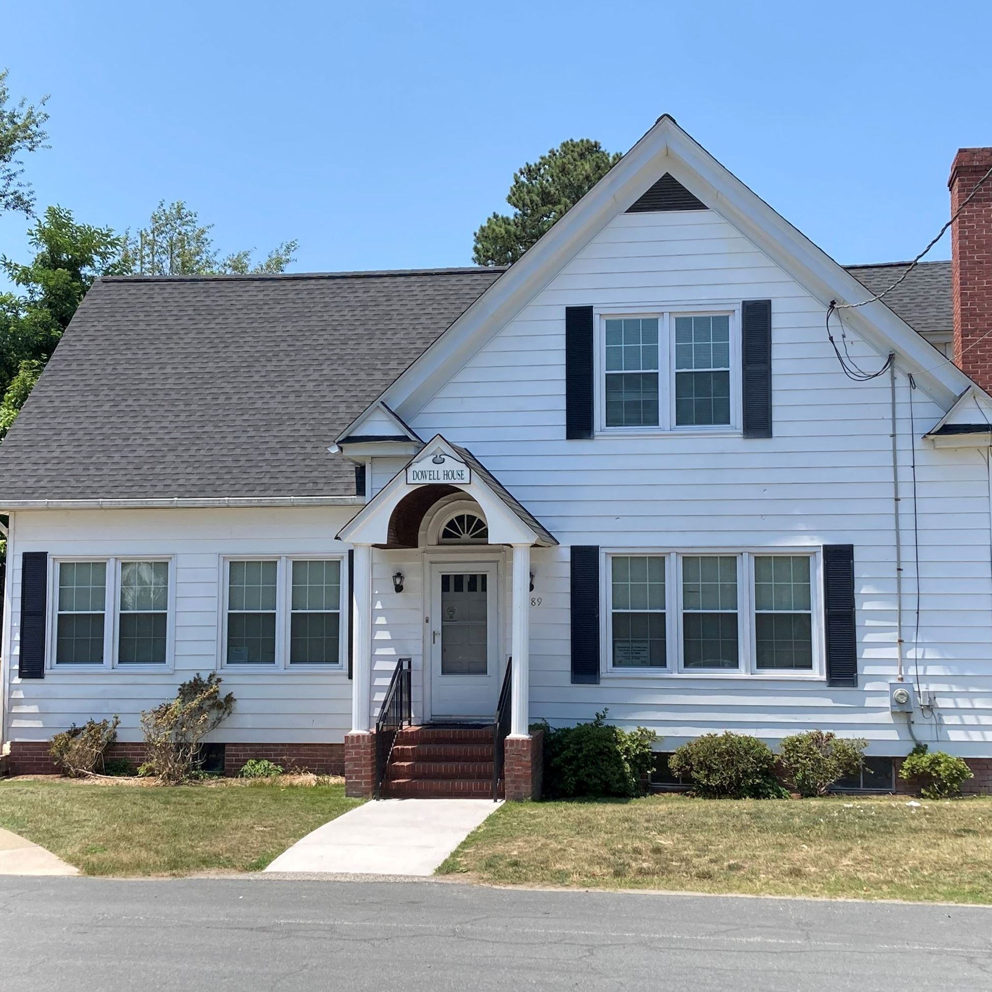 front of white house with walkway
