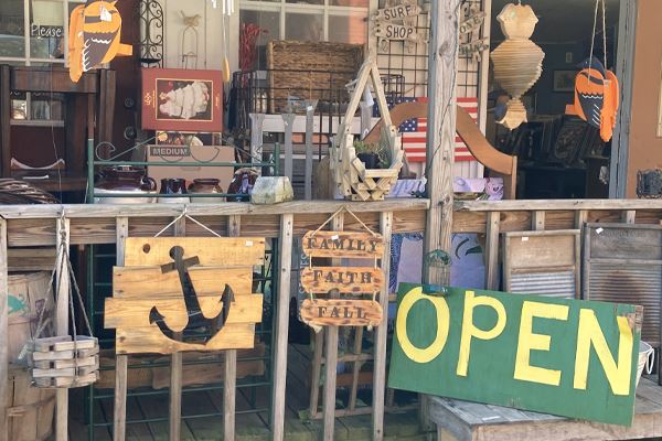 Antique signs and items outside of a storefront